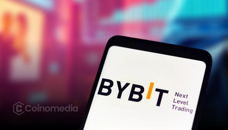 “User trading gold and stocks on Bybit TradFi interface on mobile”