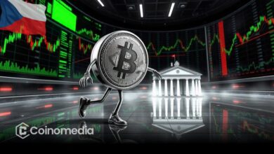 Bitcoin logo projected on Czech National Bank building at night