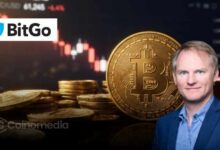Illustration of a Bitcoin wallet containing 100 BTC alongside AI security imagery, representing BitGo CEO Mike Belshe's challenge to Anthropic's Claude.